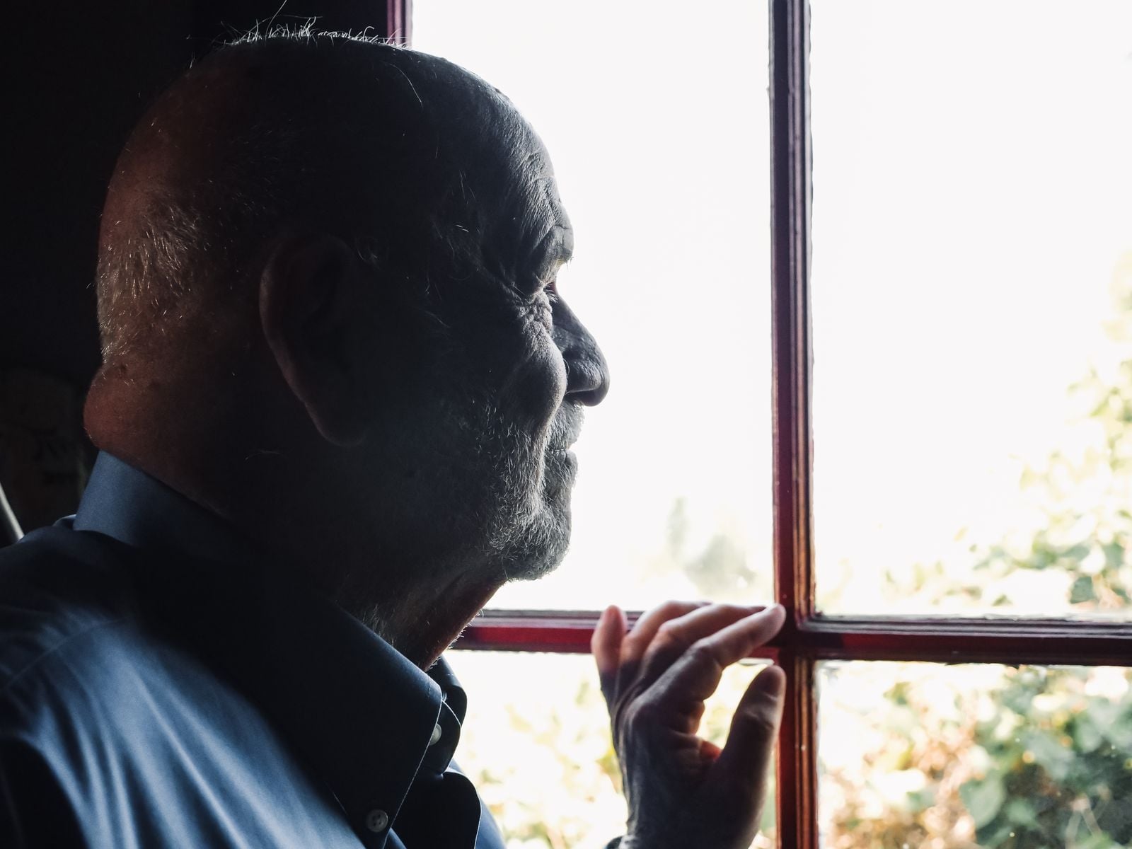elderly father looking window