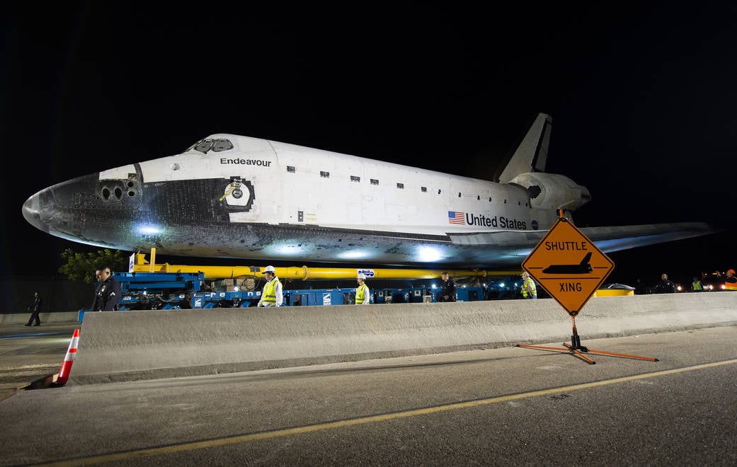 Space shuttle Endeavour weighed roughly 170,000 pounds, yet its final 12-mile journey through Los Angeles took 68 hours at no more than 2 mph—crews repeatedly stopped to trim trees and squeeze its 78-foot wingspan past obstacles with inches to spare.