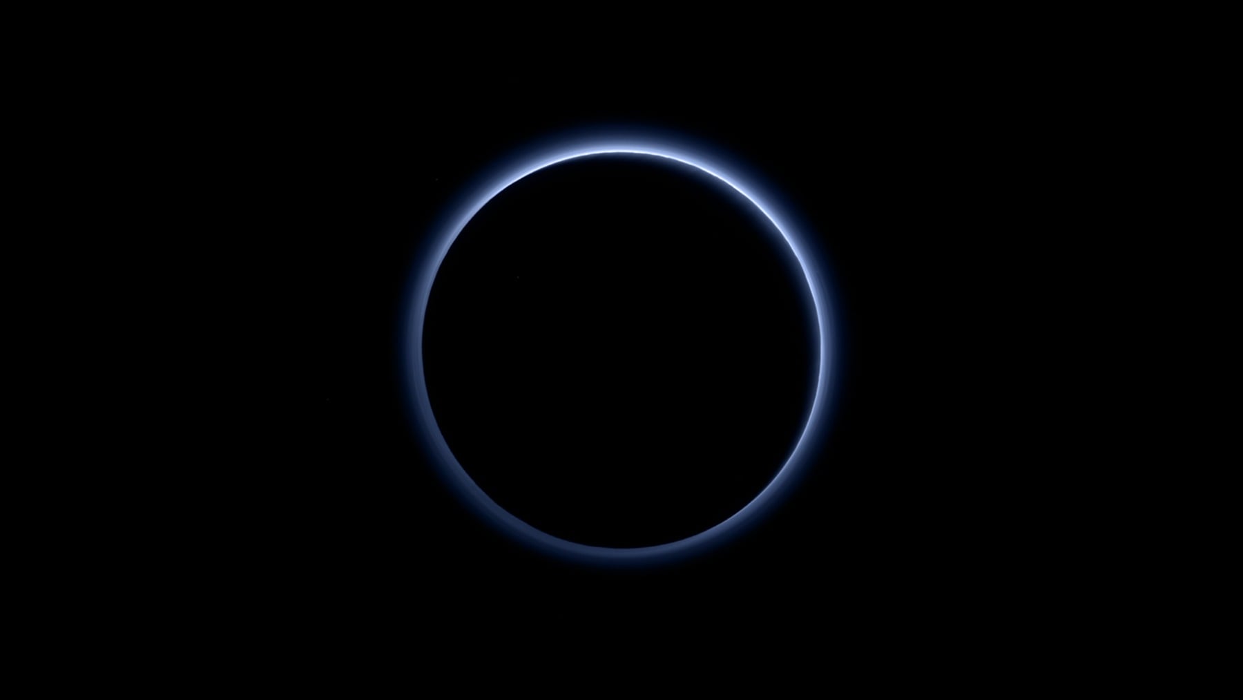 Pluto has a blue twilight: when New Horizons looked back after its 2015 flyby and saw the dwarf planet backlit by the Sun, its atmospheric haze turned out to scatter sunlight blue — a colour that surprised even the mission’s scientists.