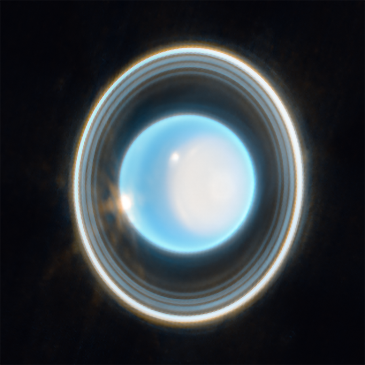 Uranus rotates almost completely on its side, tipped by 97.77 degrees, most likely by a giant impact billions of years ago — but its tilted moons keep the case from being closed