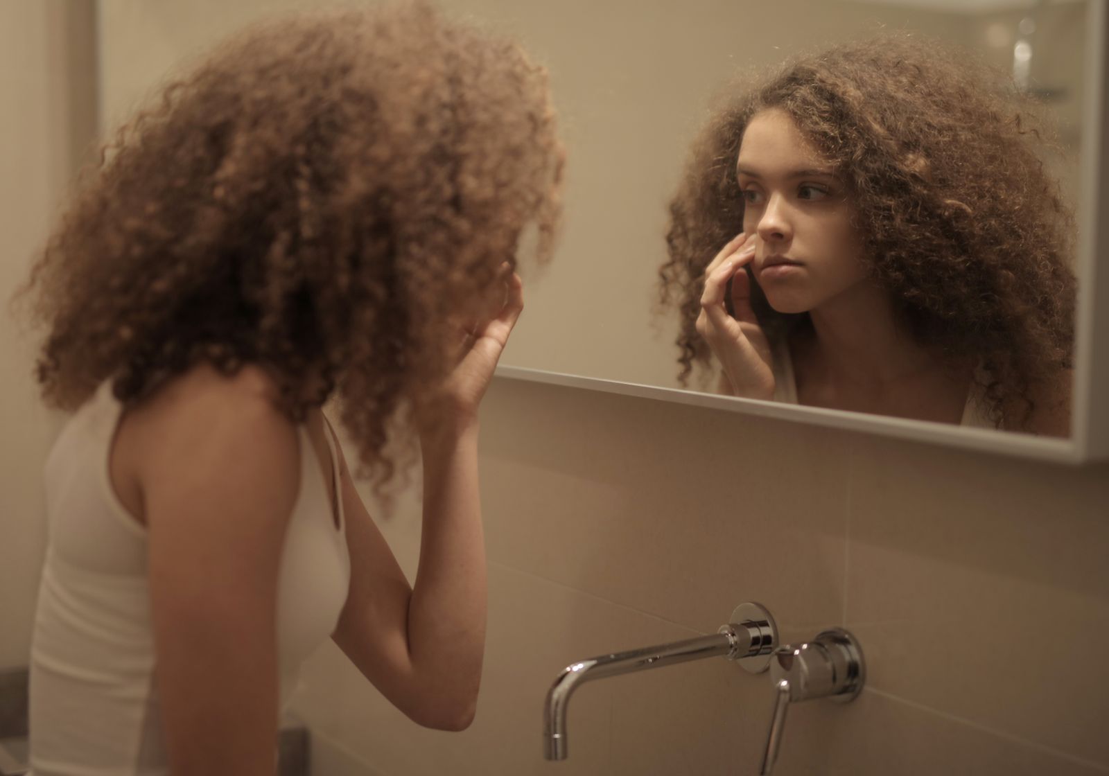 person looking in mirror