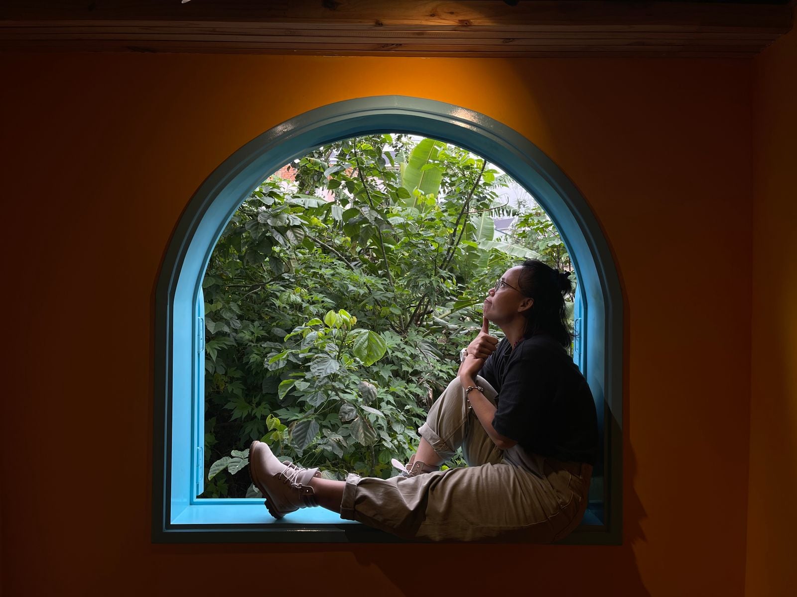 person looking out window
