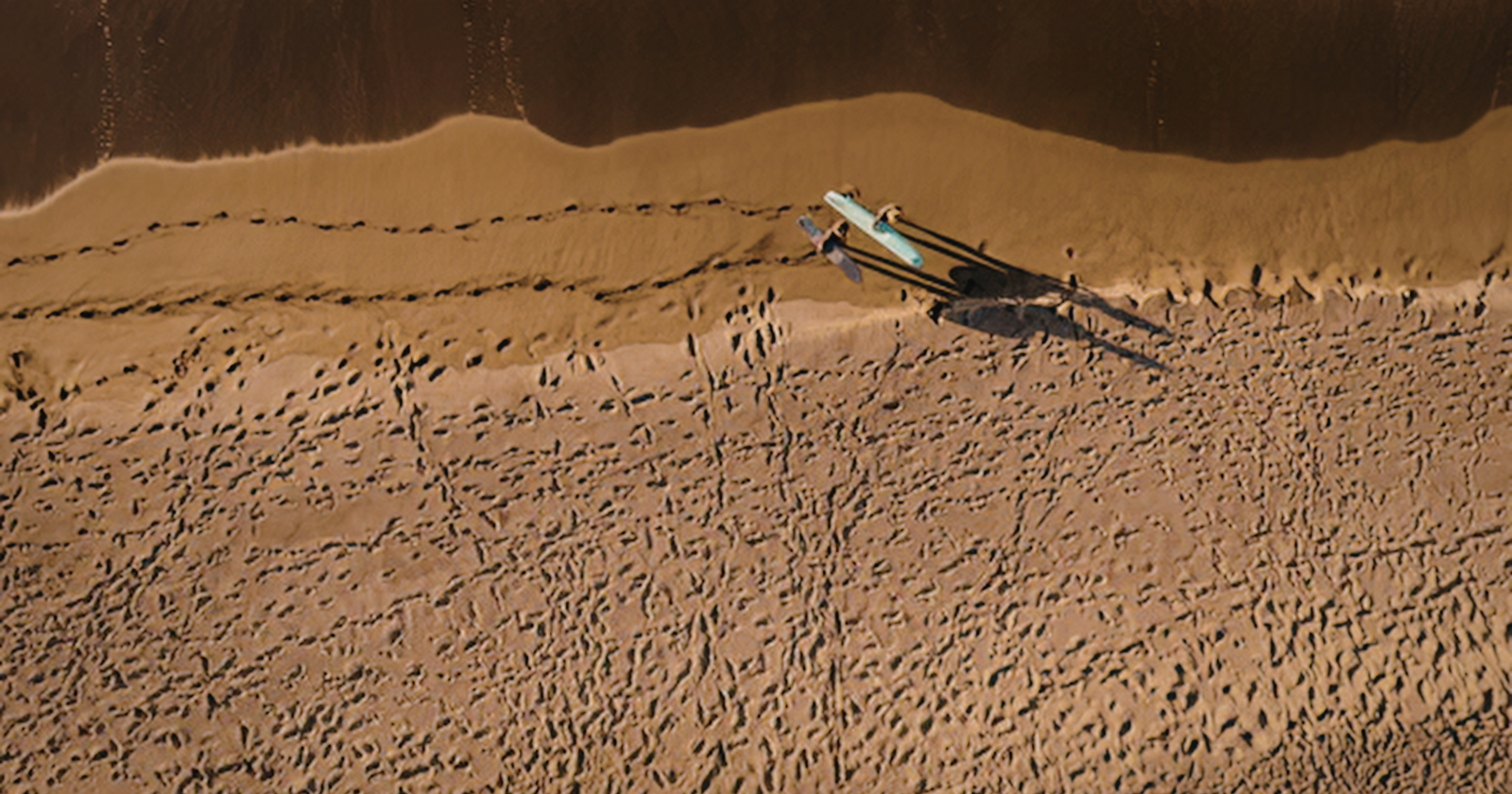 A robotic rover sitting on the surface of Mars photographed real clouds glowing red, green and blue, made of frozen carbon dioxide catching sunlight long after the ground beneath them had gone dark