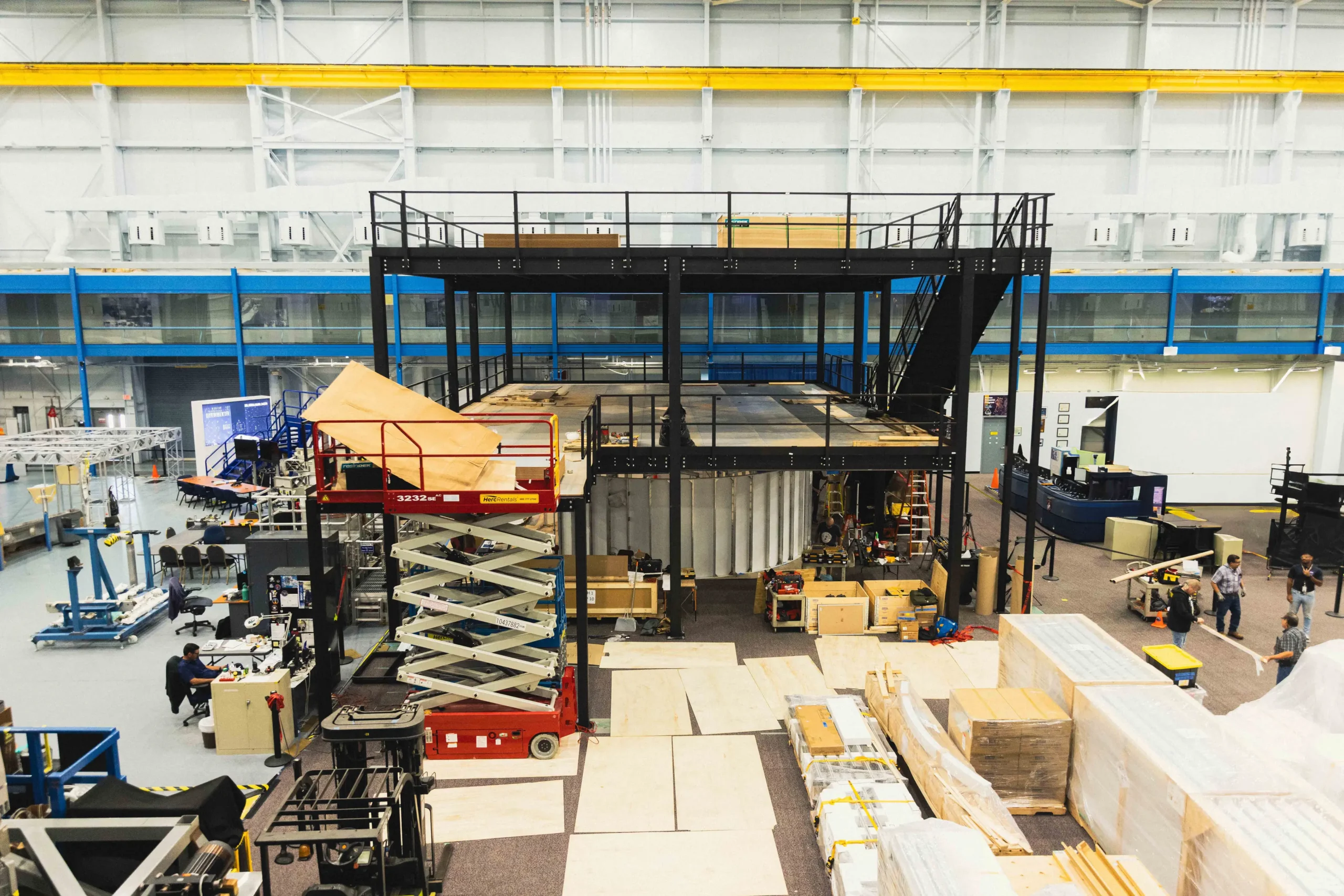 Inside Johnson Space Center’s Building 9, Starlab’s multi-floor mockup already occupies the training floor alongside hardware from SpaceX and Blue Origin — an early glimpse of how the historic astronaut-training facility could evolve as NASA transitions from the ISS to commercially operated stations around 2030.
