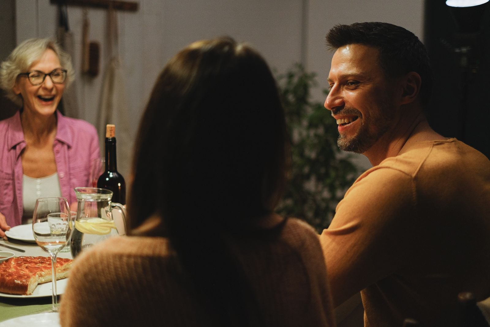 The habit of laughing at your own hard stories before anyone else can react isn't resilience, it's often a decades-old strategy for controlling how much sympathy the room is allowed to offer you