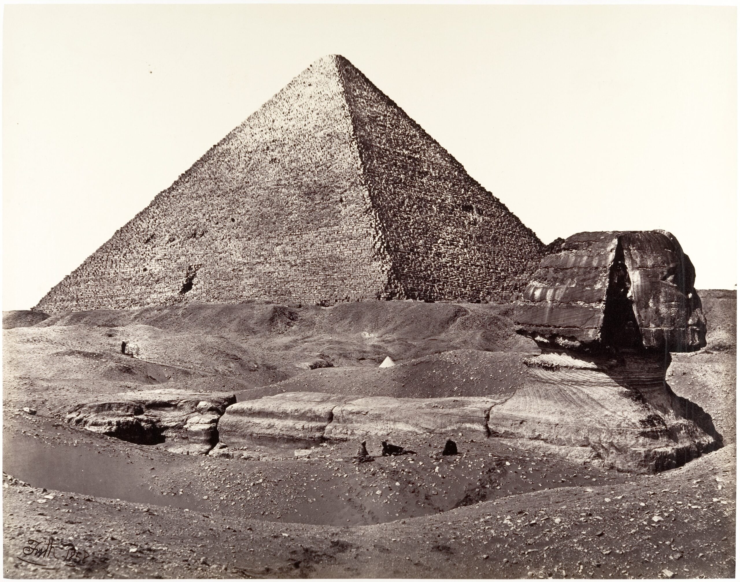 Great Pyramid of Khufu and the Great Sphinx at Giza in a historic photograph.