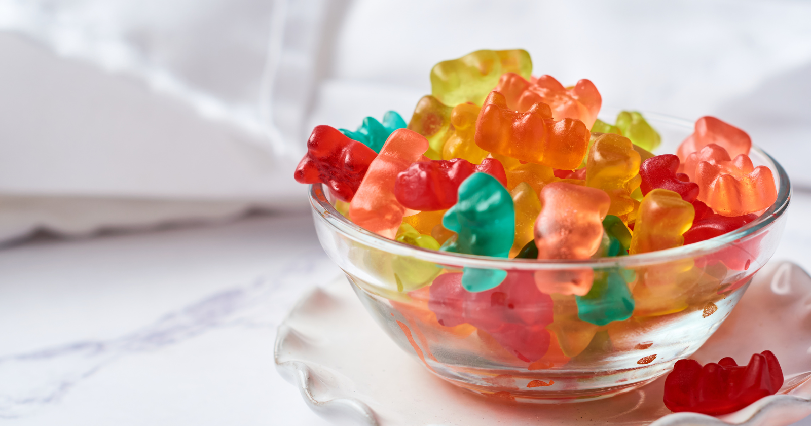 A Michigan State chemist made gummy bears out of a wind turbine blade and ate them, because the resin his team designed dissolves in an alkaline solution into food-grade potassium lactate — a chemistry built so the 170-foot blades now being sawed up and buried can end as candy, plexiglass or new blades instead