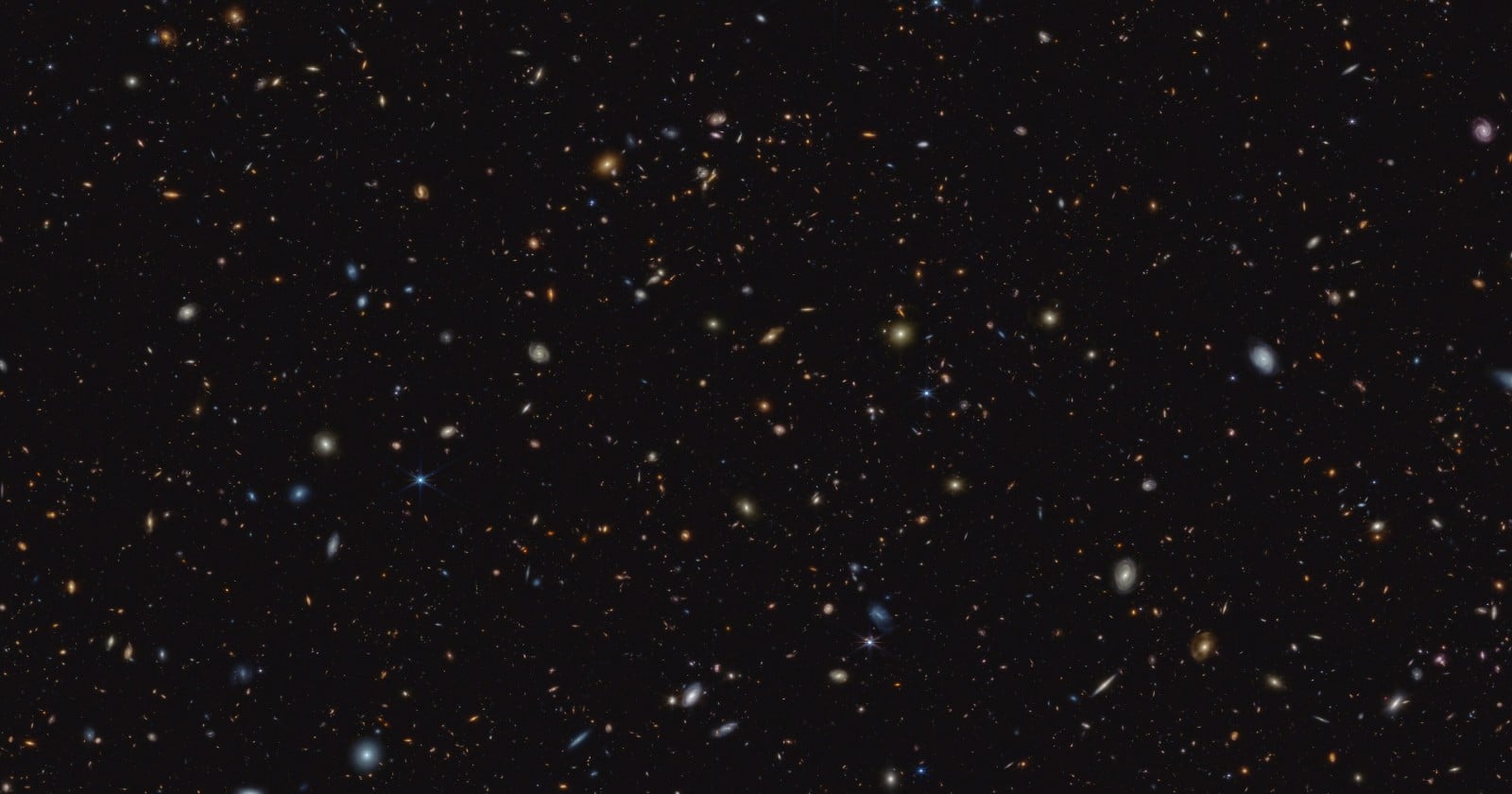 A short gamma-ray burst has looked since 2006 like it went off in empty space, and archival Webb images have now turned up a faint galaxy two arcseconds away that, if it is the burst's real home, would account for an energy never robustly observed in a well-studied short burst, a projected 42-kiloparsec offset, and a merger rate this one event alone inflates past what gravitational-wave detectors infer