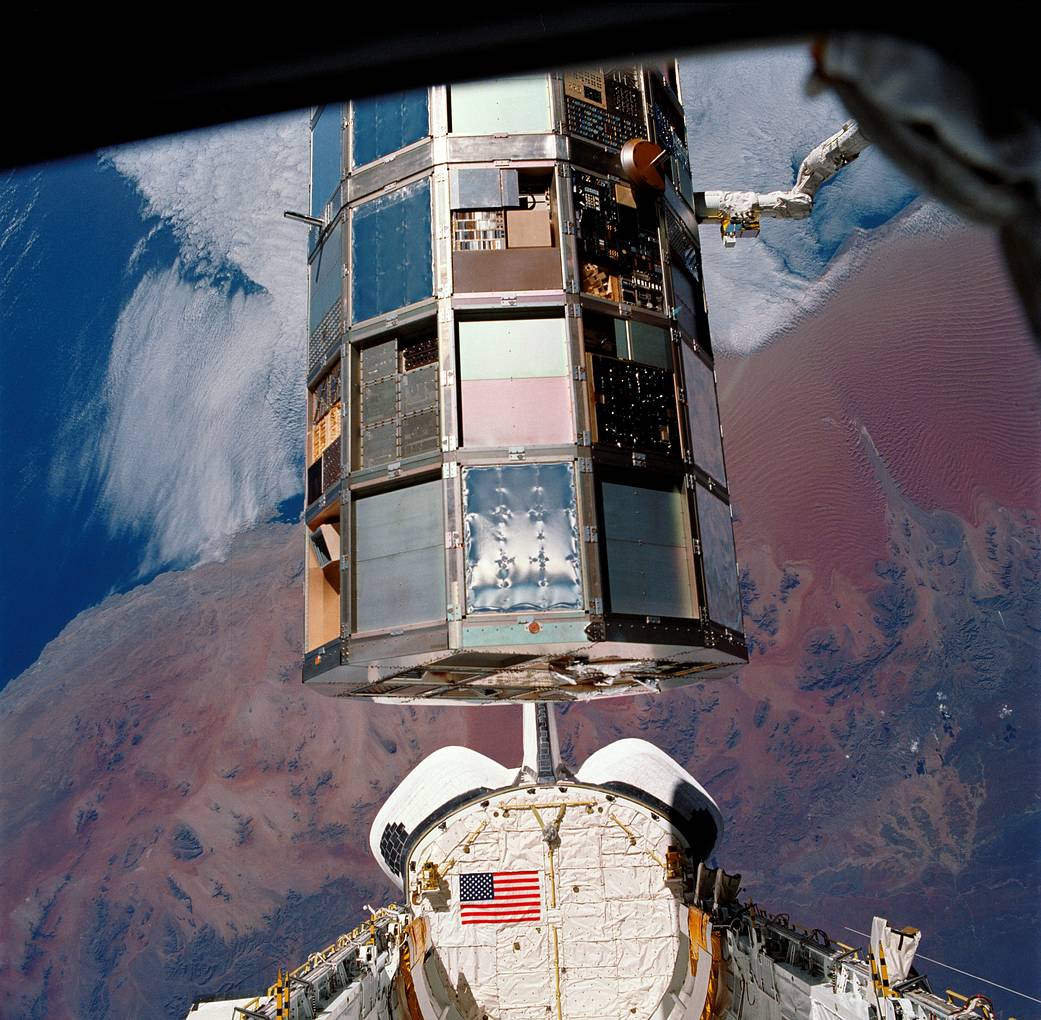 In 1984, NASA left a satellite carrying 57 experiments in orbit for a planned 10 months — repeated delays stretched the trip to 69 months before Columbia brought the entire laboratory home inside its cargo bay, its exposed surfaces weathered by years in space.