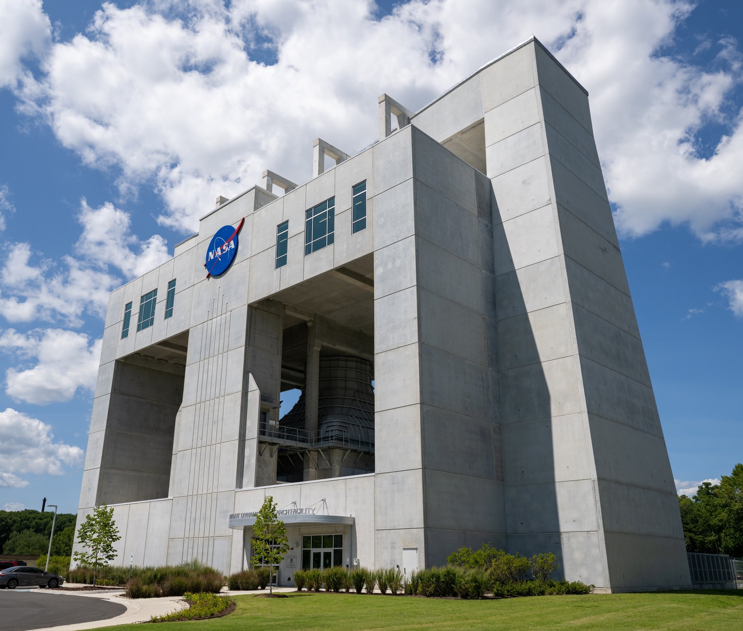 Exterior of NASA Langley Flight Dynamics Research Facility with NASA logo and facility name on the building