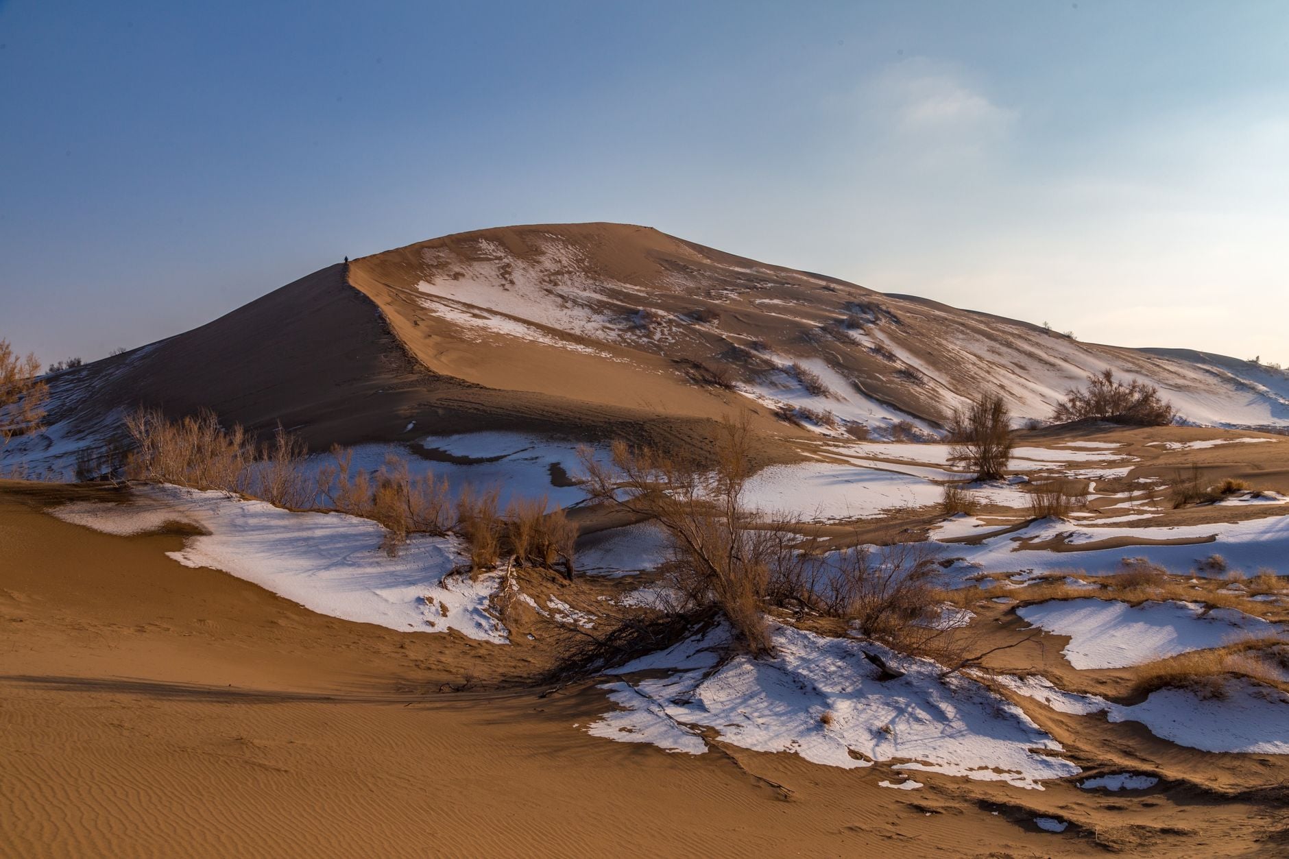 What winter means on Mars: temperatures can plunge to −130°C, carbon dioxide falls as snow or freezes directly onto the ground, as much as 16% of the atmosphere becomes part of the winter polar cap, and air pressure planet-wide swings by roughly 25% over the seasonal cycle.