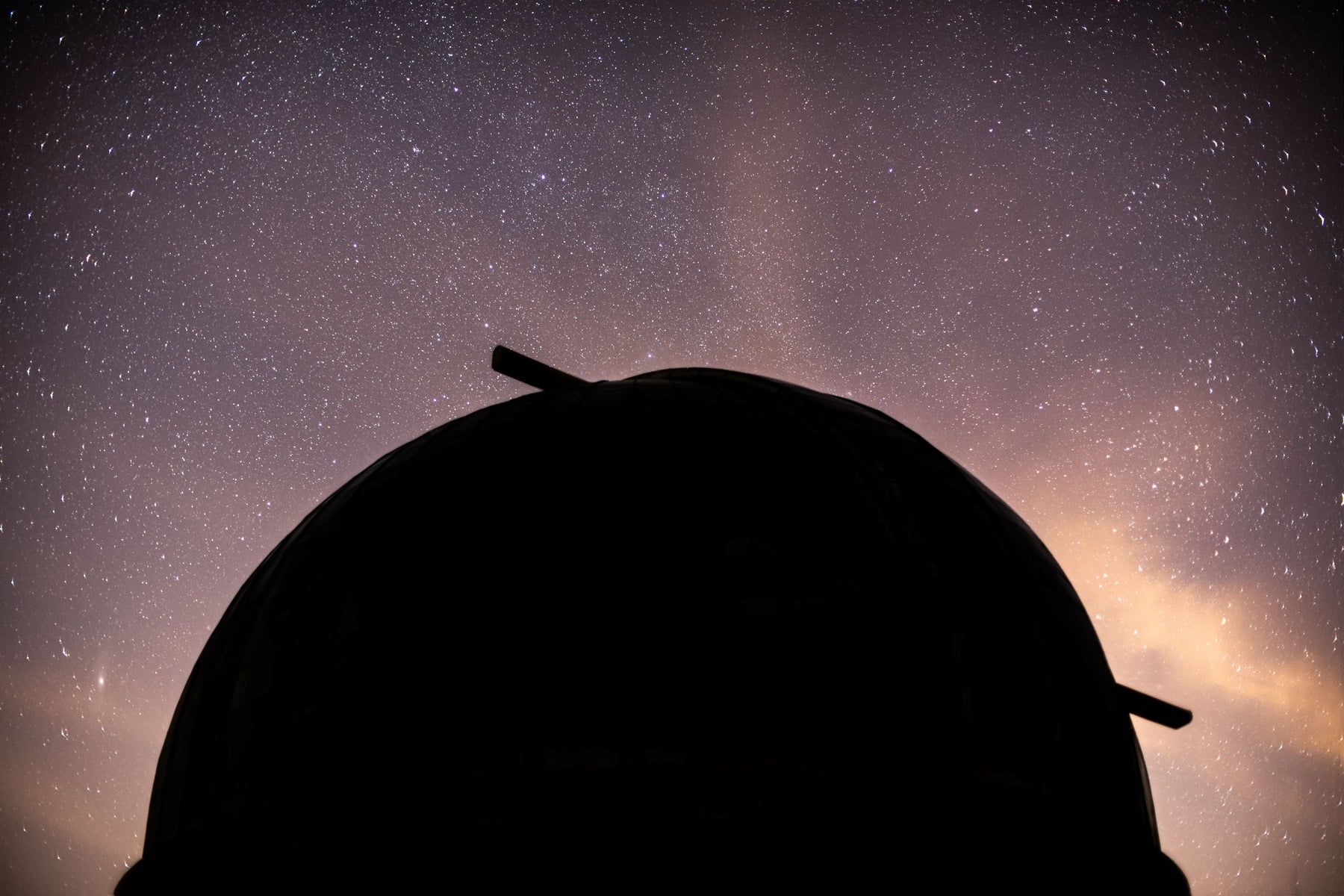 Hubble and Webb found 27 of the faintest trans-Neptunian objects ever directly seen, including bodies only a few kilometres wide—and unexpectedly found fewer tiny objects than some planet-formation models predicted, suggesting the Kuiper Belt was not ground down by collisions in the way astronomers expected.