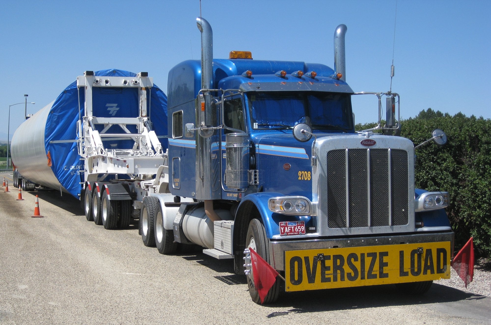 Near Brisbane, turbine tower sections were routed onto an exit ramp to clear one low overpass; a truck that stayed on the Warrego Highway struck the Mount Crosby bridge and shut westbound lanes for two and a half days