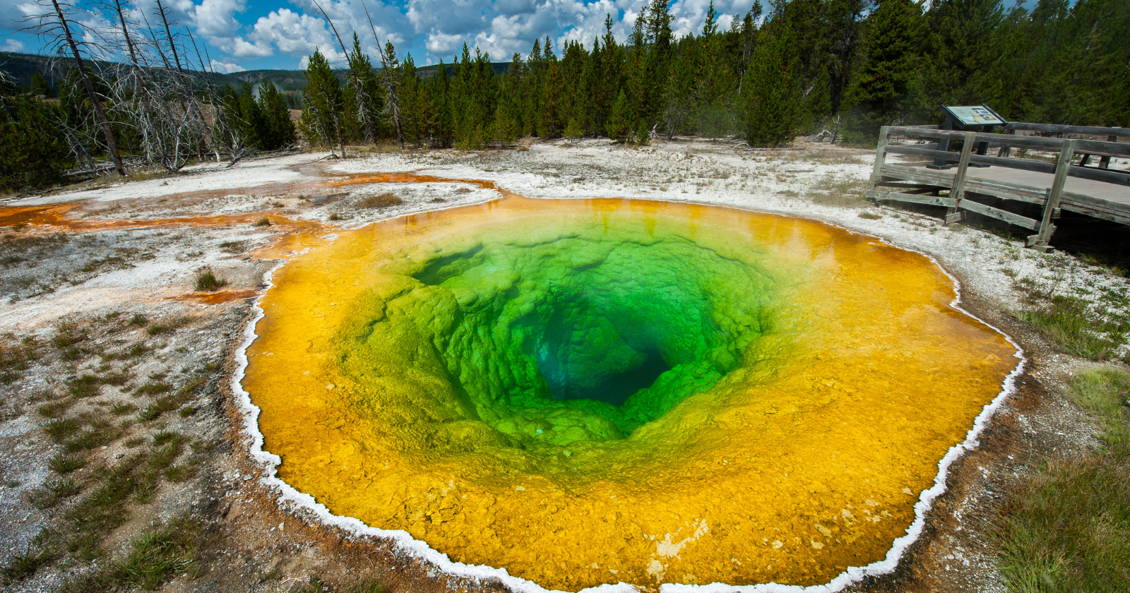 For decades visitors tossed coins and trash into Yellowstone's Morning Glory Pool, and the debris clogged its vent and cooled the water — the spring named for its deep blue now runs green and orange, and rangers say the original color may never come back