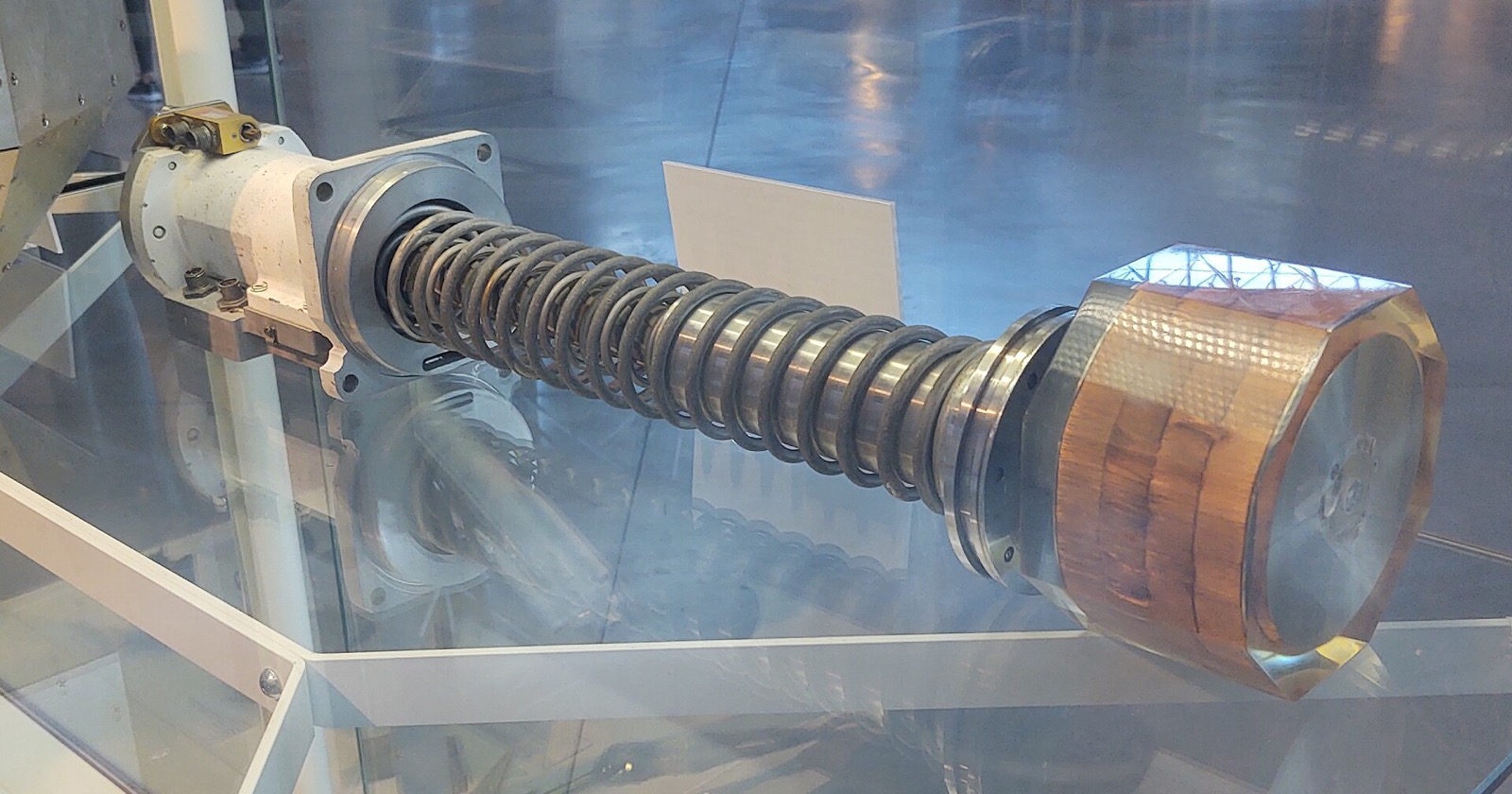 Project West Ford's spring-loaded dipole dispenser and copper-coloured needle canister in a glass display case